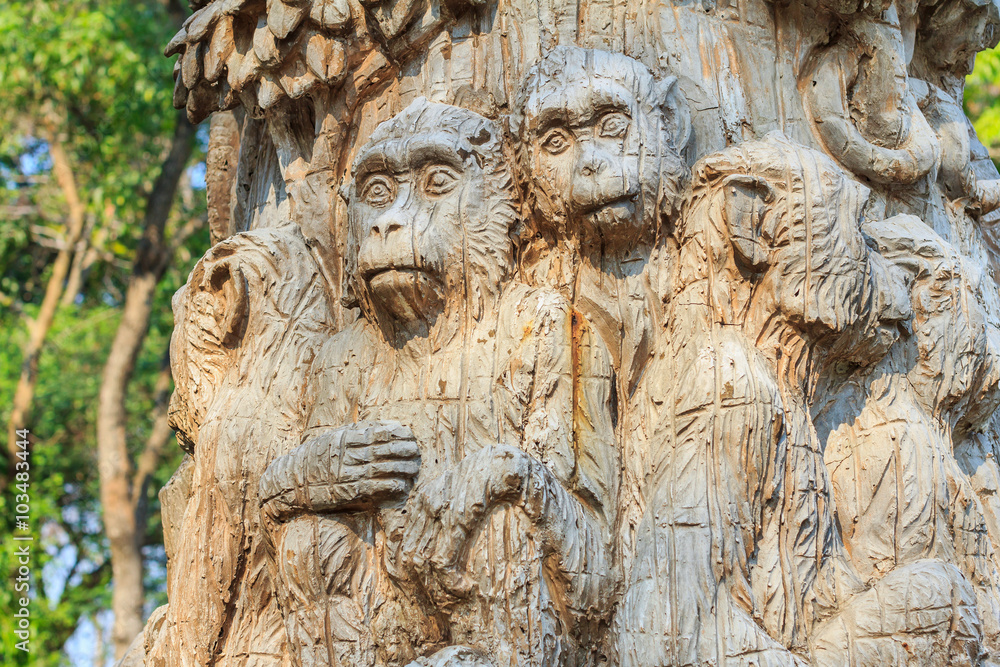 wood carving of monkey at zoo