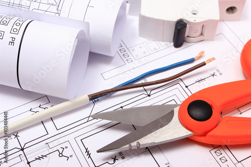 Accessories for engineer jobs and rolls of diagrams on construction drawing