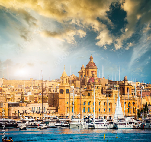 view on Birgu and the harbour with boats photo