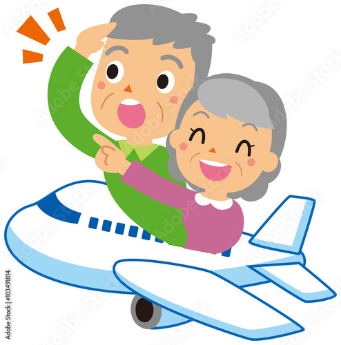 飛行機に乗る老夫婦