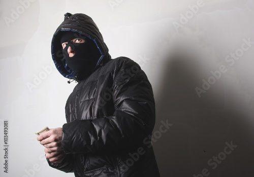 Canvas Print Robber with an aming gun