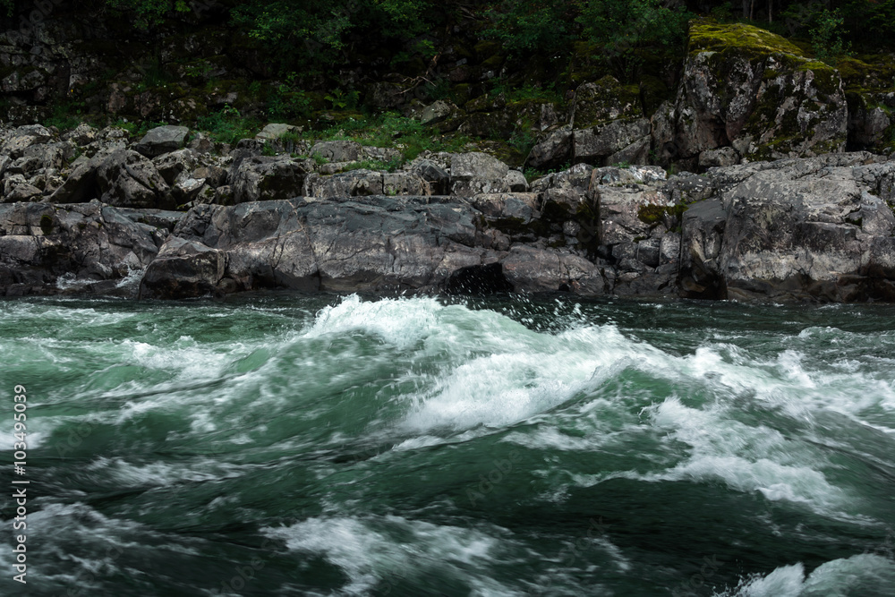 big boulders in line with the mountain river big boulders in line with the mountain river