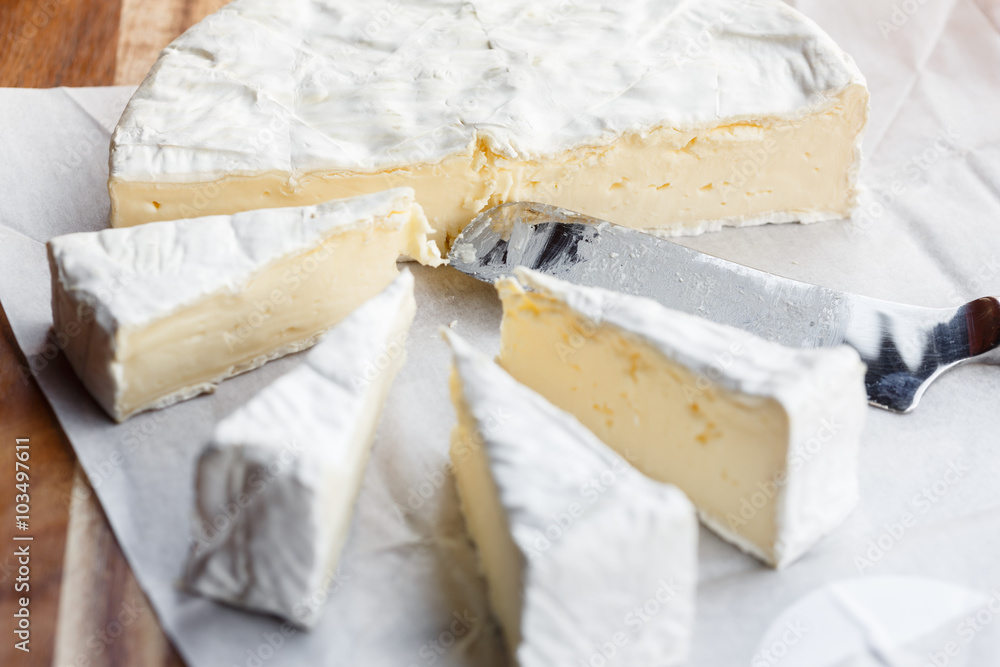 Fresh Brie cheese and slices Fresh Brie cheese and slices