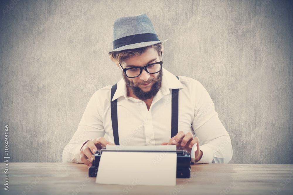 Composite image of hipster wearing eye glasses and hat working Composite image of hipster wearing eye glasses and hat working