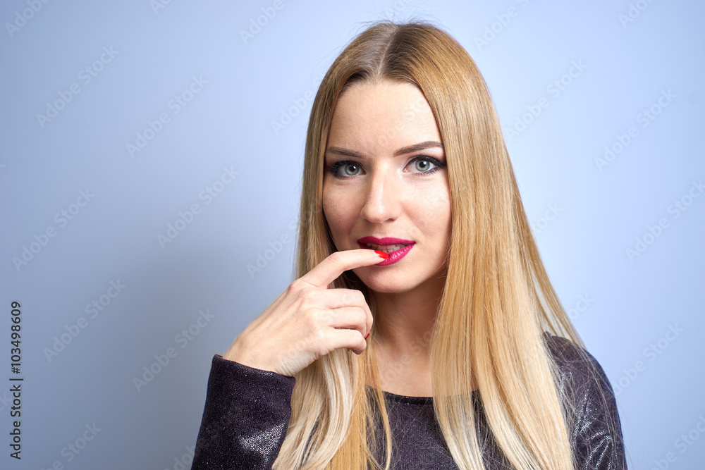 Fashion model with bright makeup. Portrait of young fashion woman with long blond hair Fashion model with bright makeup. Portrait of young fashion woman with long blond hair