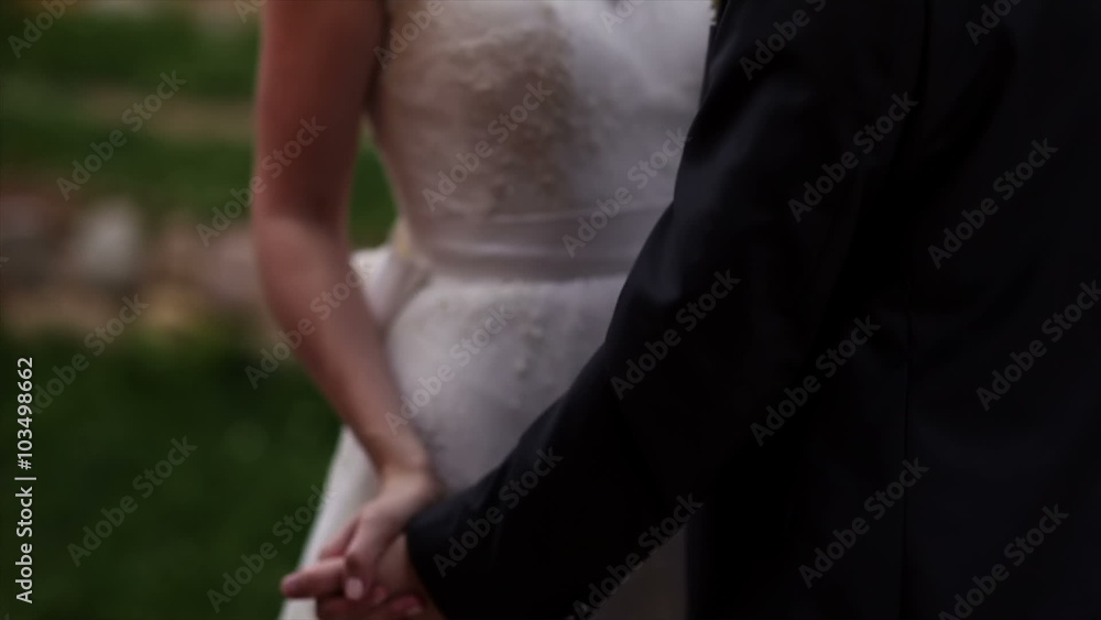 bride and groom dance outdoors in the park. bride and groom dance outdoors in the park.