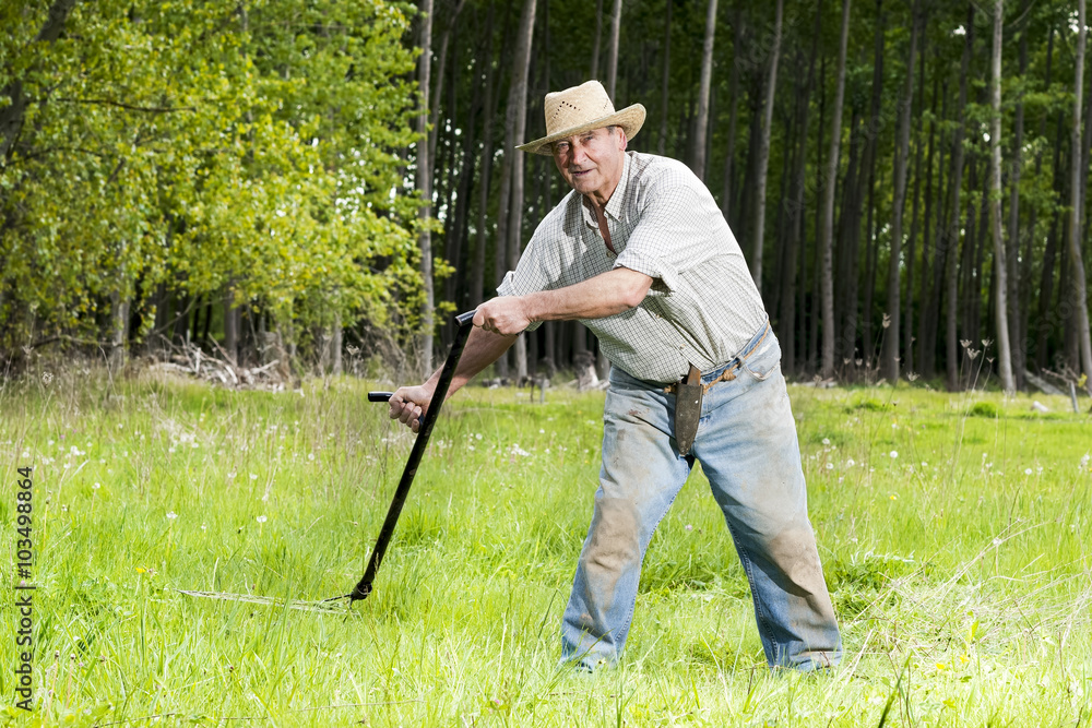 reaper man with a scythe for mow the grass in the field reaper man with a scythe for mow the grass in the field