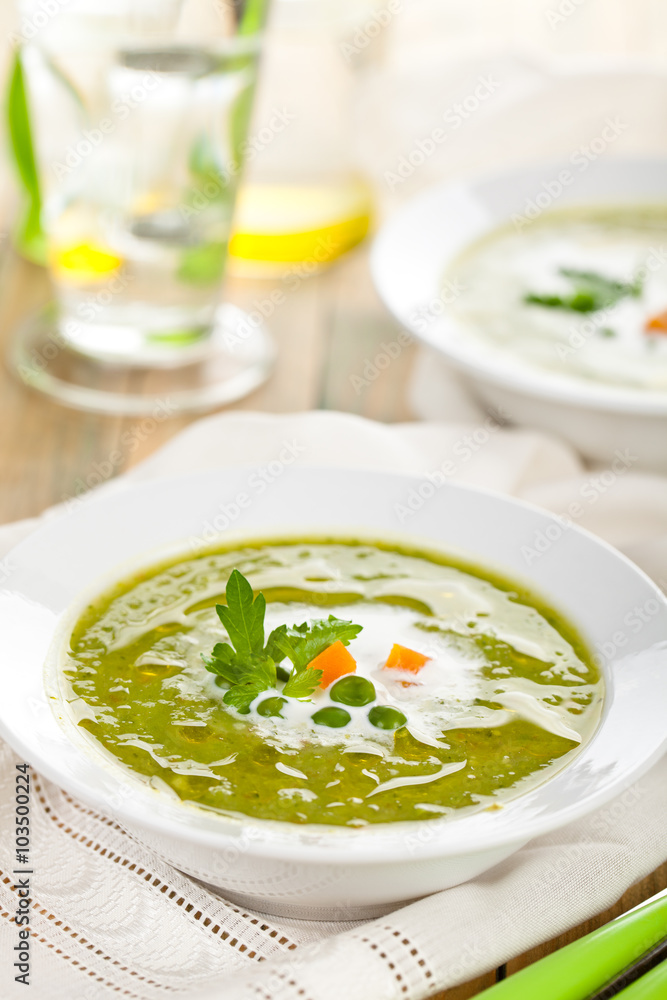Green pea soup in bowls. Green pea soup in bowls.