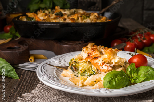 Baked pasta with broccoli, cauliflower, cheese and bechamel sauc