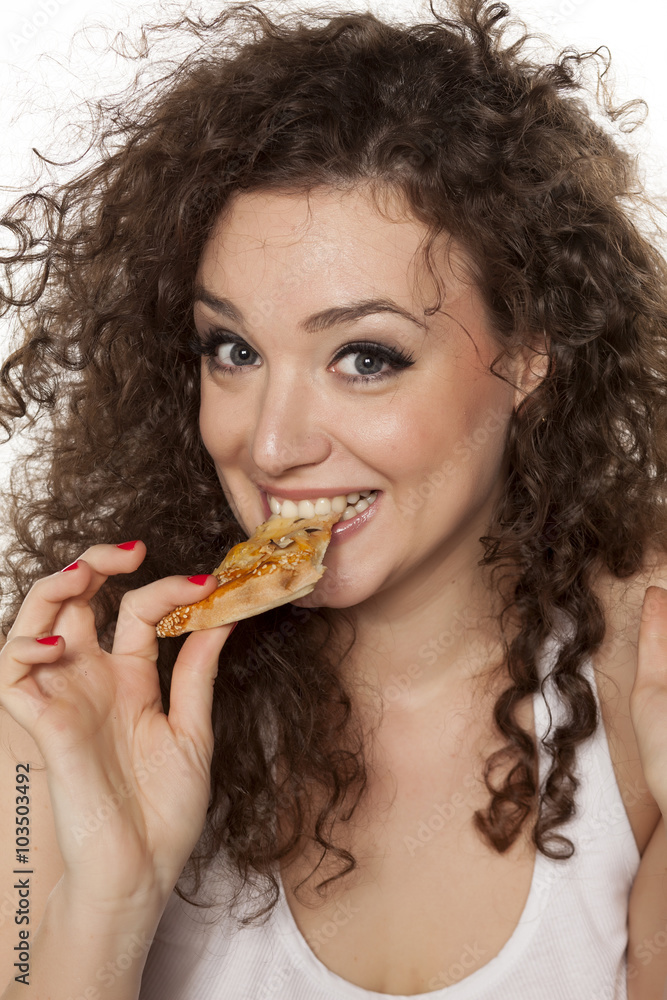 happy beautiful girl enjoying the taste of her pizza