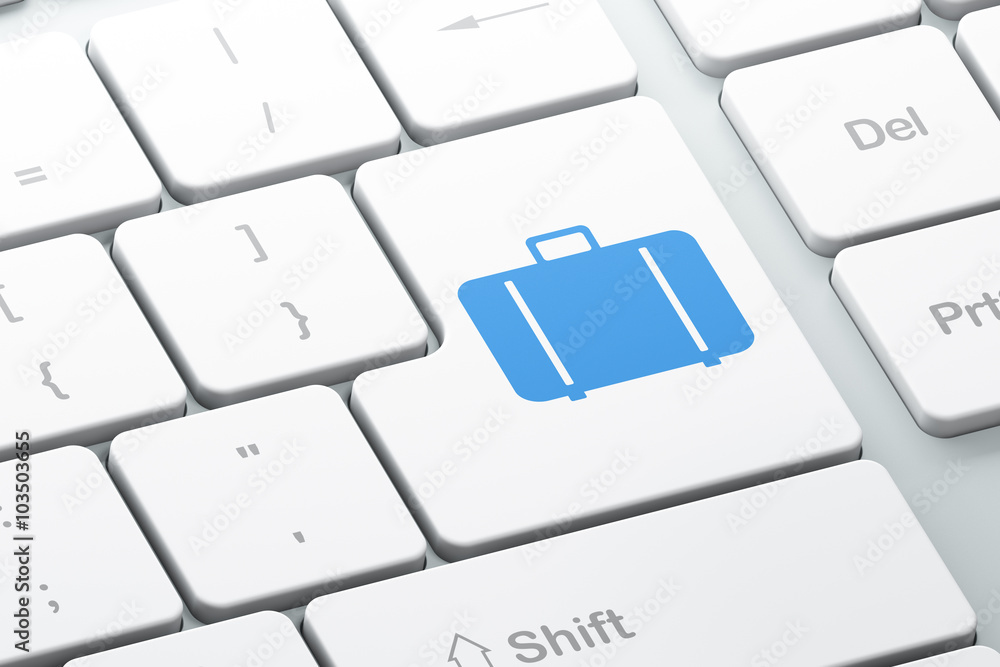 Tourism concept: Bag on computer keyboard background Tourism concept: Bag on computer keyboard background