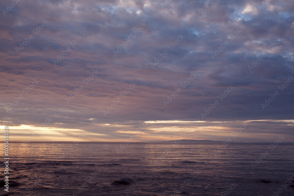 Clouds at sunset over the sea. The Sea of Okhotsk. Peninsula Kony. Magadan Region. Russia.