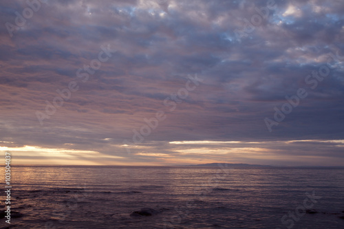 Clouds at sunset over the sea. The Sea of Okhotsk. Peninsula Kony. Magadan Region. Russia.