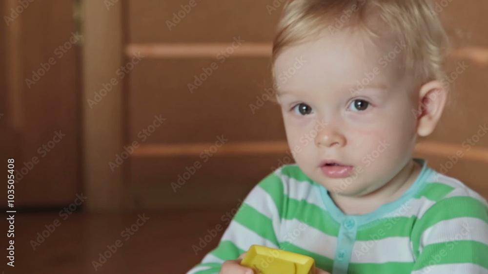 A cute little blond boy play with kinetic sand A cute little blond boy play with kinetic sand