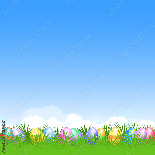 Easter background and colorful Easter eggs in green grass