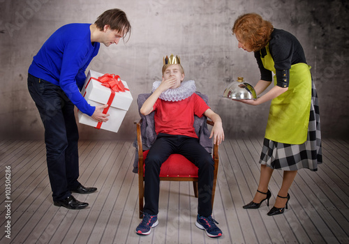Parents try hard to please their son. Parenting style concept photo