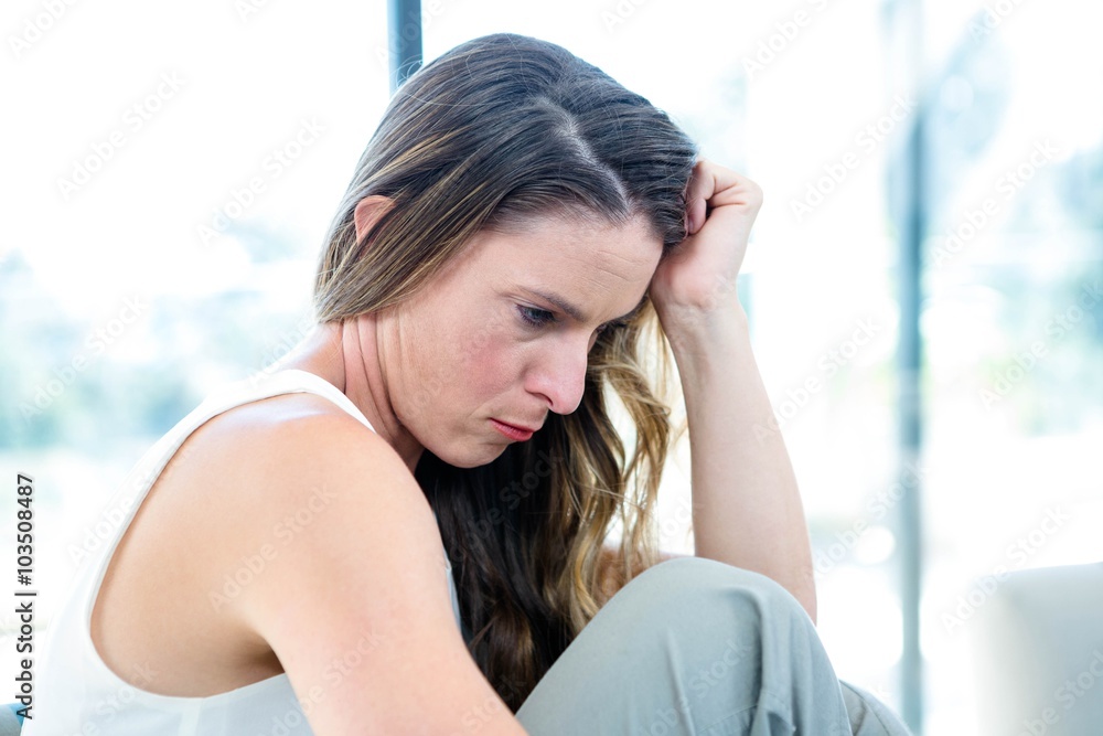 Fototapeta premium distracted woman with her head in her hands