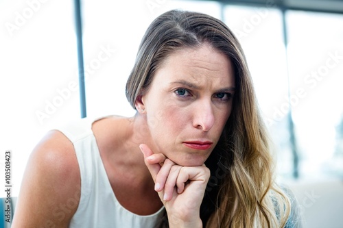 Tableau sur toile thoughtful woman looking  at the camera