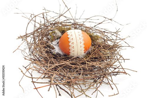 Nest with easter egg on a white background © nmelnychuk