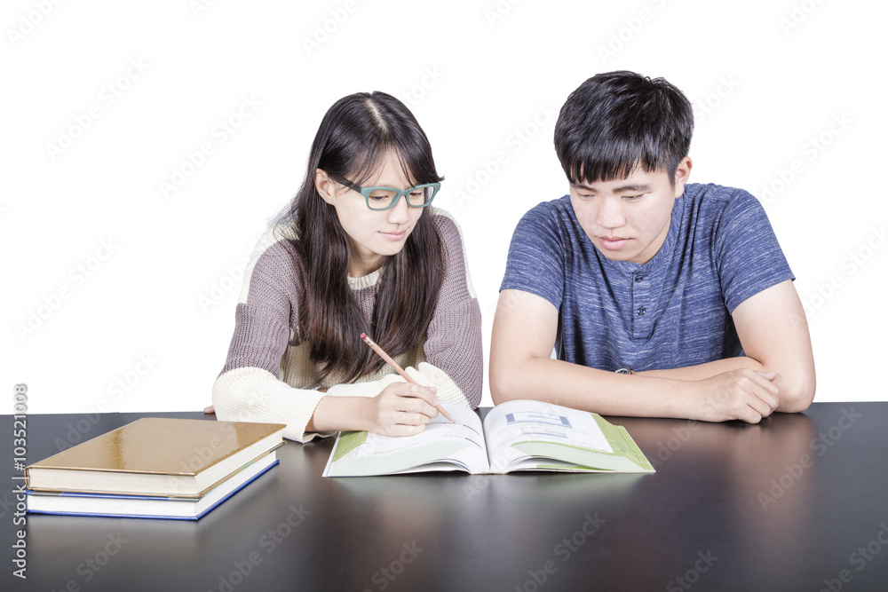 Two young students with books and studying, isolated. Two young students with books and studying, isolated.