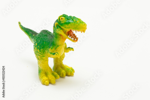 plastic dinosaur toy. over a white background © chystmaks