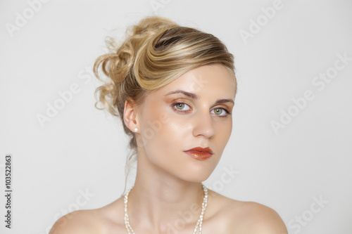 Young beautiful blond woman with a wedding hairstyle