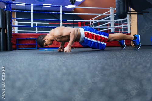 Boxer doing push ups photo