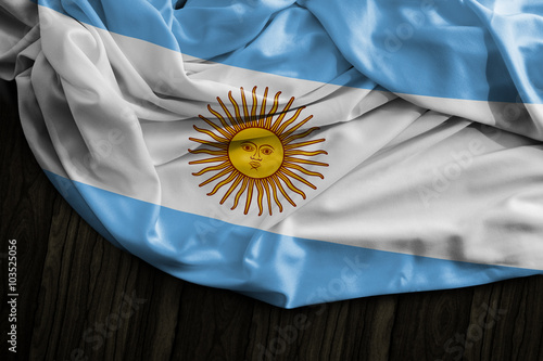 Obraz na plátně Argentine flag on wooden table