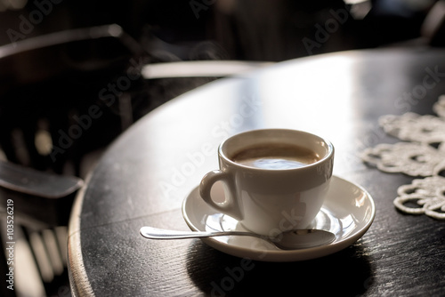Canvas Print coffee cup on table in cafe