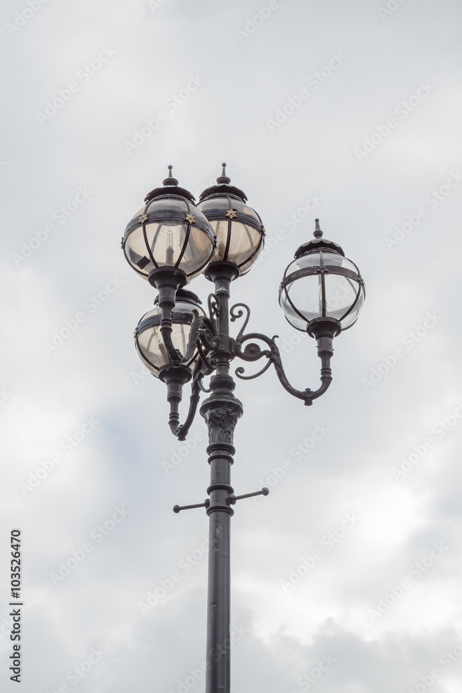 Old-fashioned street lamp against the sky. Dublin, Ireland. Old-fashioned street lamp against the sky. Dublin, Ireland.