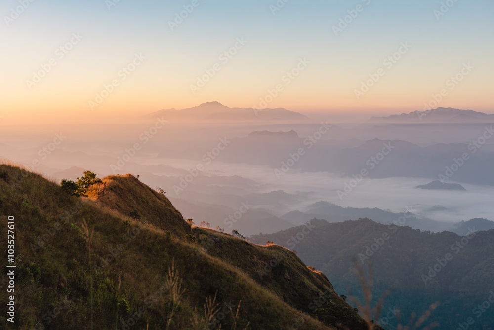 Bright sun shining over the golden mountain with view of mountain range background, mountain gap at Doi Tu Lay (mon Tu Lay) , Tak province Thailand