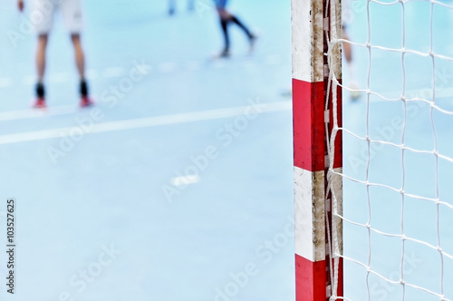 Handball goalpost with players in background