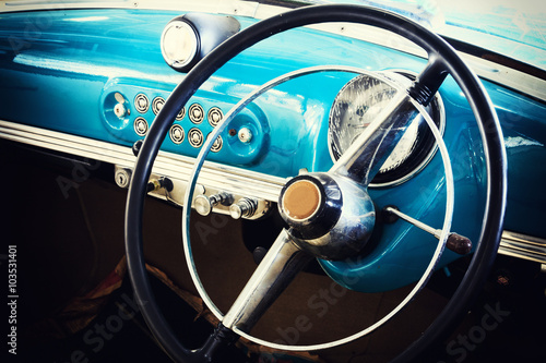 Close-up of Wheel Details of Vintage Car © wittayayut