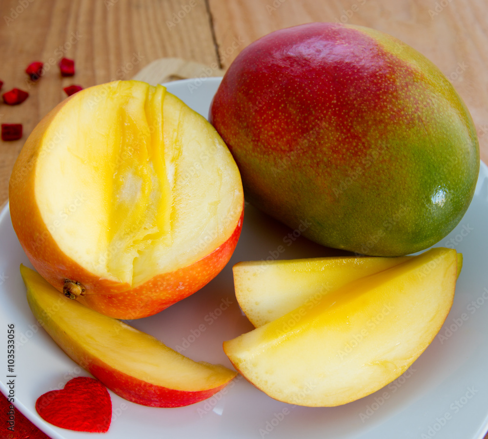 Mango fruit on wooden background.