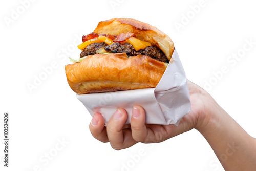 hand holding tasty hamburger isolated on  white background.
