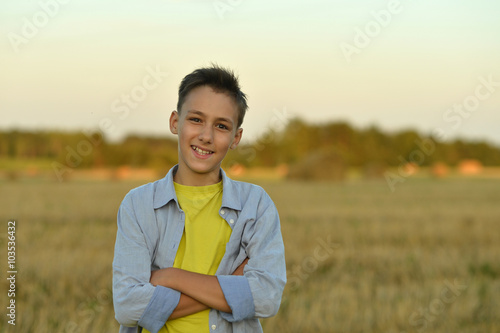 Boy in field enjoying nature