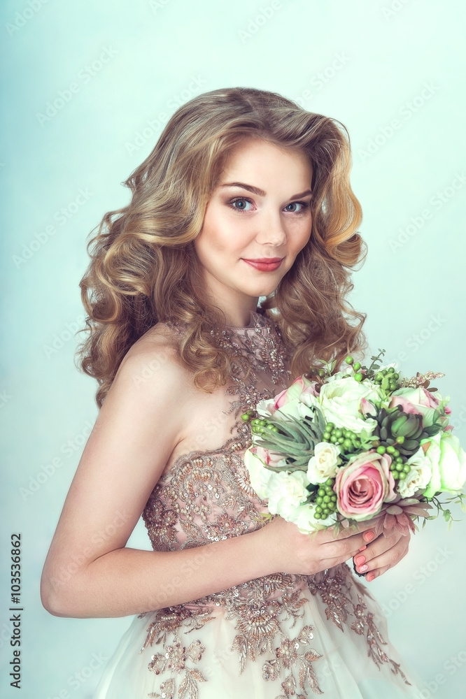 Beautiful bride in wedding dress holding bouquet and looking. Portrait of young bride. Wedding. Studio shot. Beautiful bride in wedding dress holding bouquet and looking. Portrait of young bride. Wedding. Studio shot.
