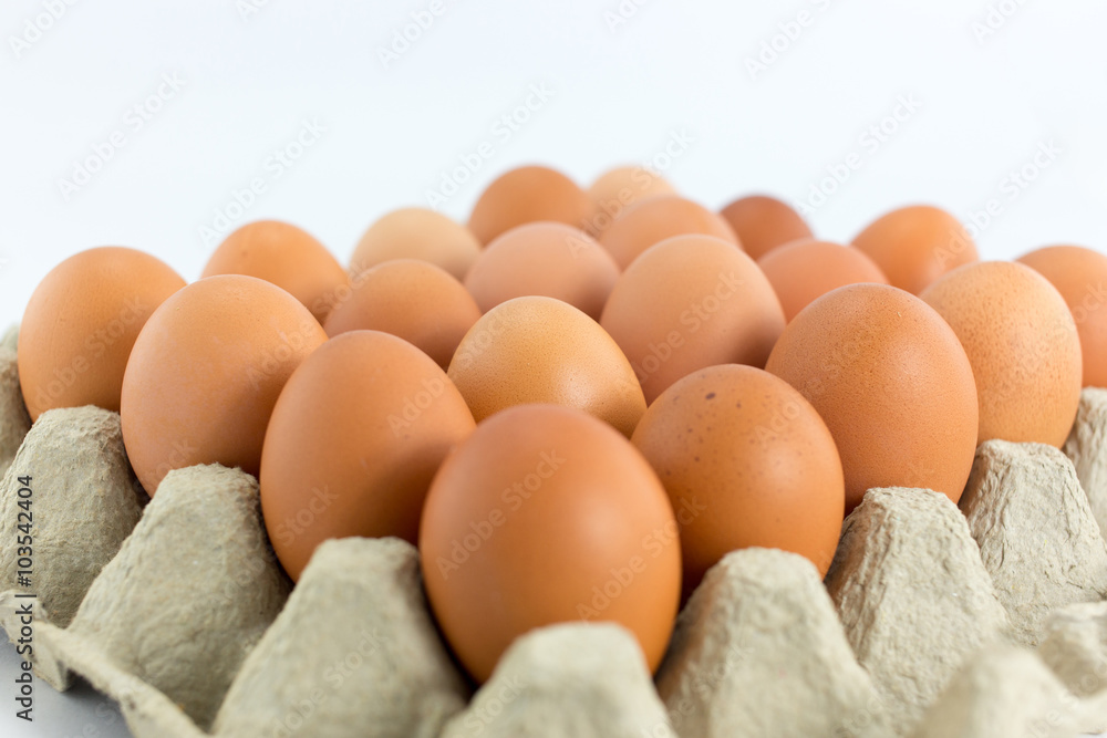 Eggs in tray on white background Eggs in tray on white background