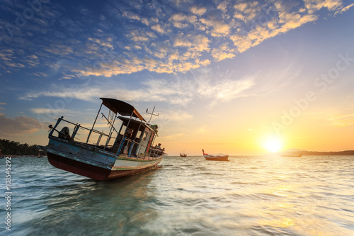 Fishing boat stand at sunrise beach in Phuket © SKT Studio