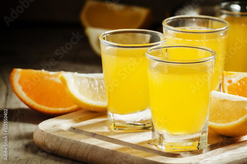 Beverage with orange and lemon juice and soda, selective focus