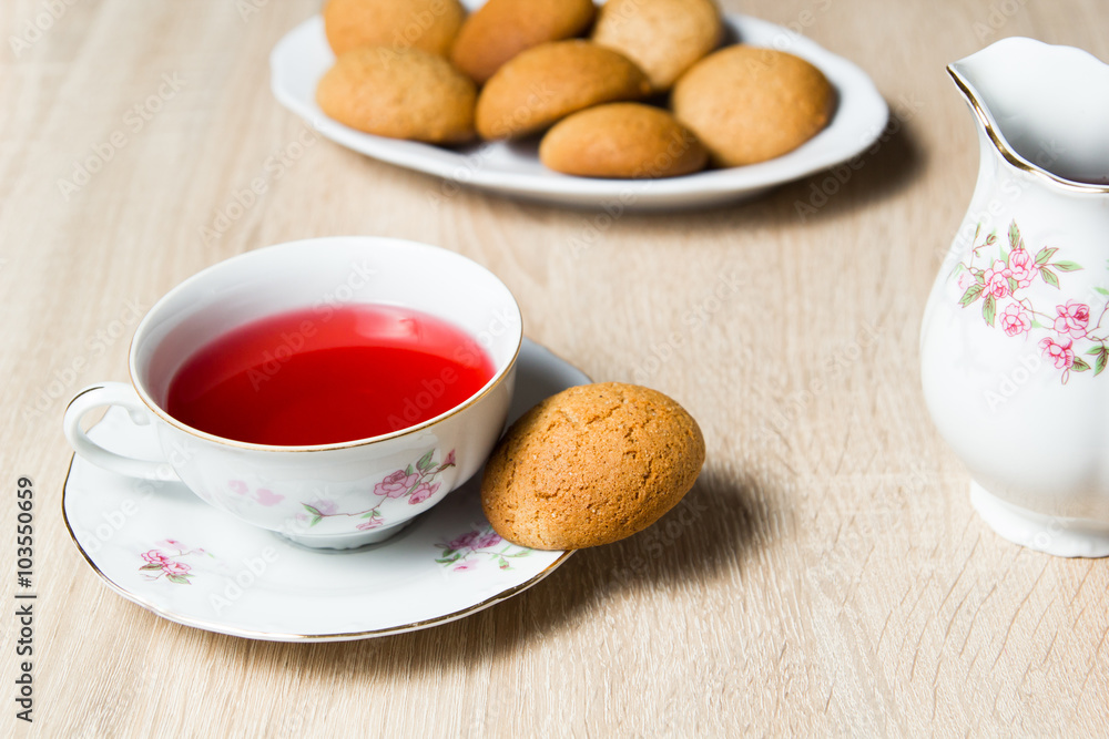 Cup of tea and cookies on wooden table Cup of tea and cookies on wooden table