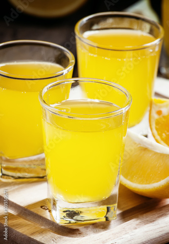Beverage with orange and lemon juice and soda, selective focus