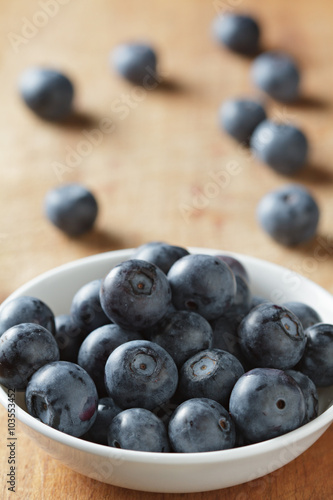 Blueberries in bowl on wooden. Blueberry contain antioxidant org