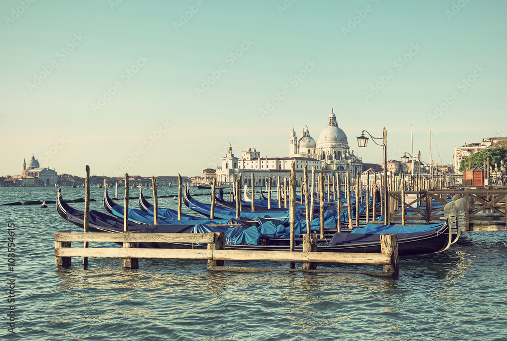 view from San Marco on gondolas and the famous church of Santa Maria della Salute, Venice, Italy, vintage style
