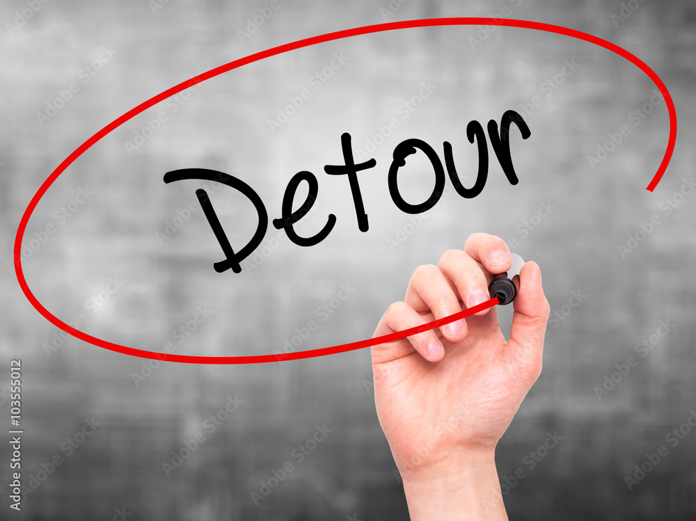 Man Hand writing Detour with black marker on visual screen Man Hand writing Detour with black marker on visual screen