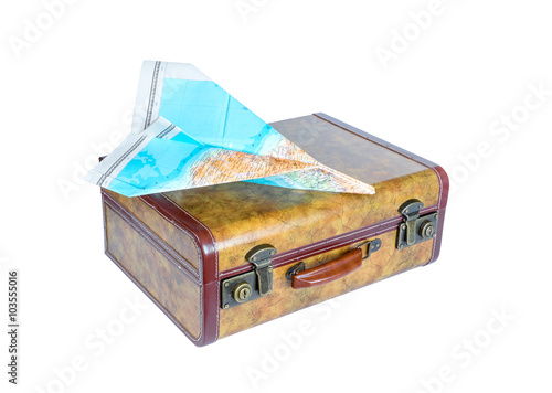 Suitcase and paper airplane on white background