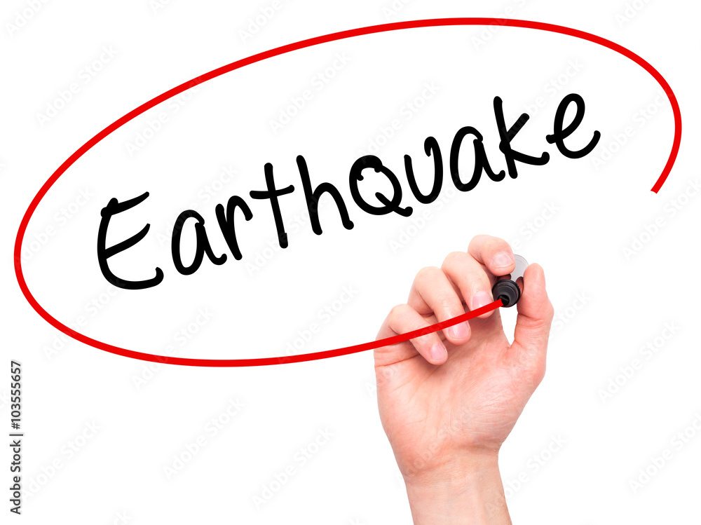 Man Hand writing Earthquake with black marker on visual screen Man Hand writing Earthquake with black marker on visual screen