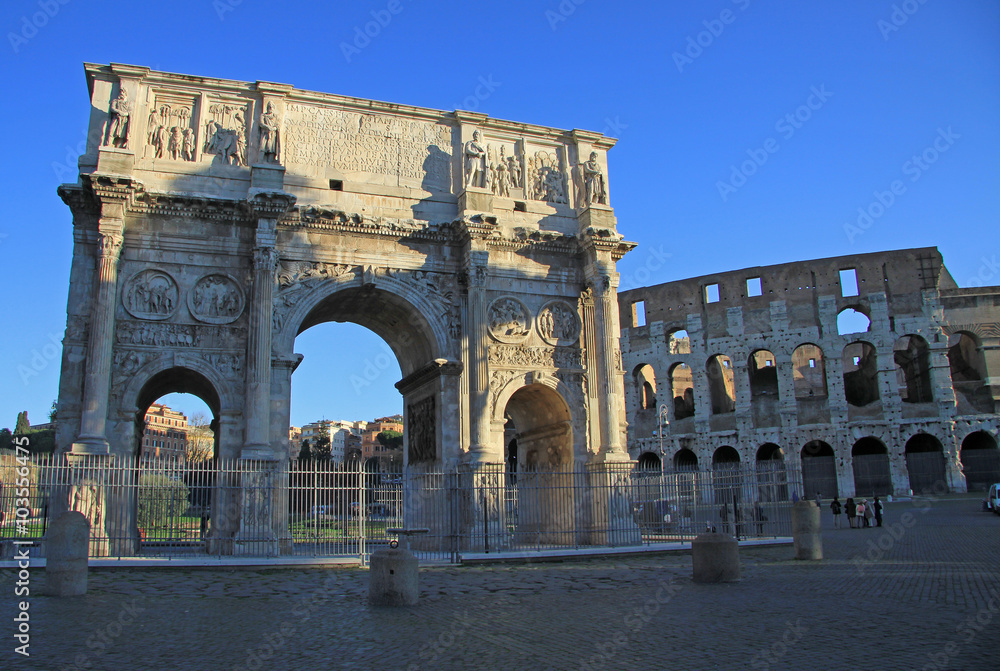 ROME, ITALY - DECEMBER 21, 2012: Arch of Constantine next to the Roman Coliseum, Rome, Italy