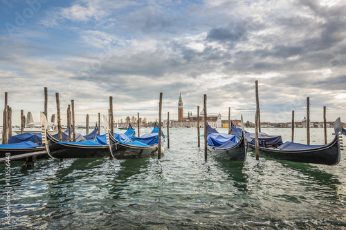 Gondolas in lagoon of Venice and San Giorgio island in background  Italy  Europe  