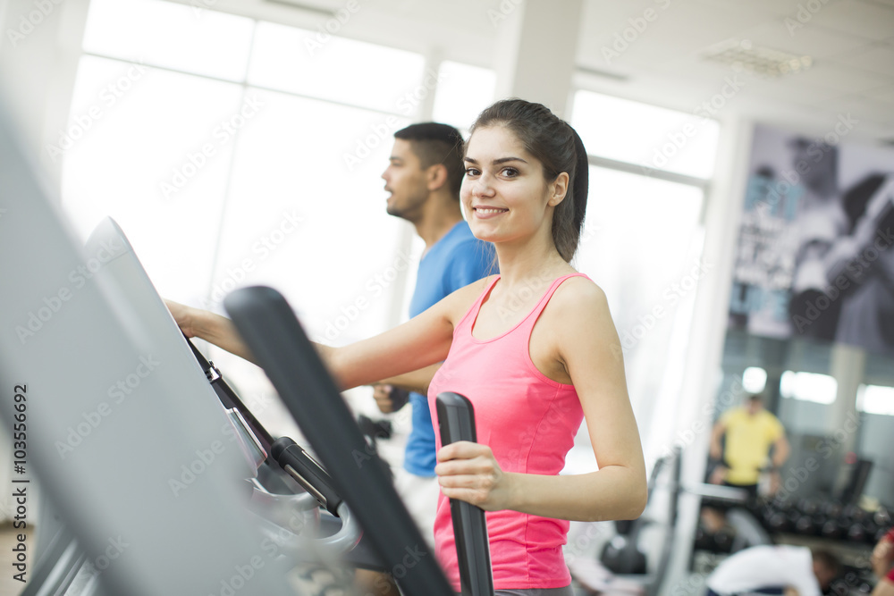 Young multiracial people training in the gym Young multiracial people training in the gym